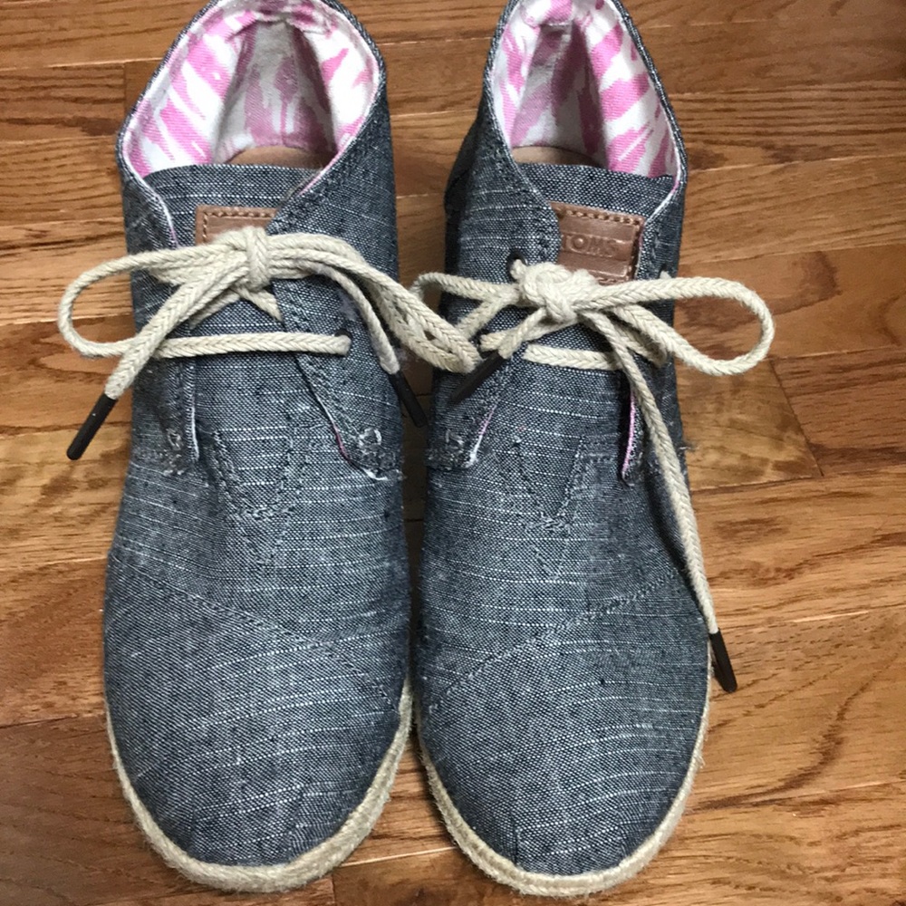 Women’s black Tom wedges.